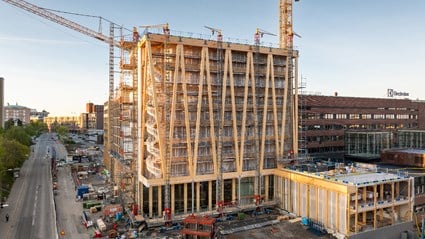 The solid glulam beams are clearly visible towards the street.