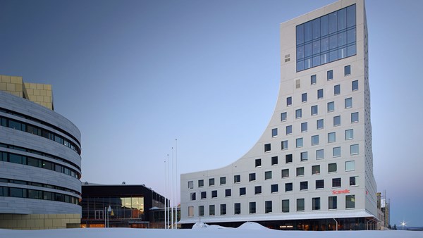 Winter view of the facade, with its special architecture resembling a valley and mountain.